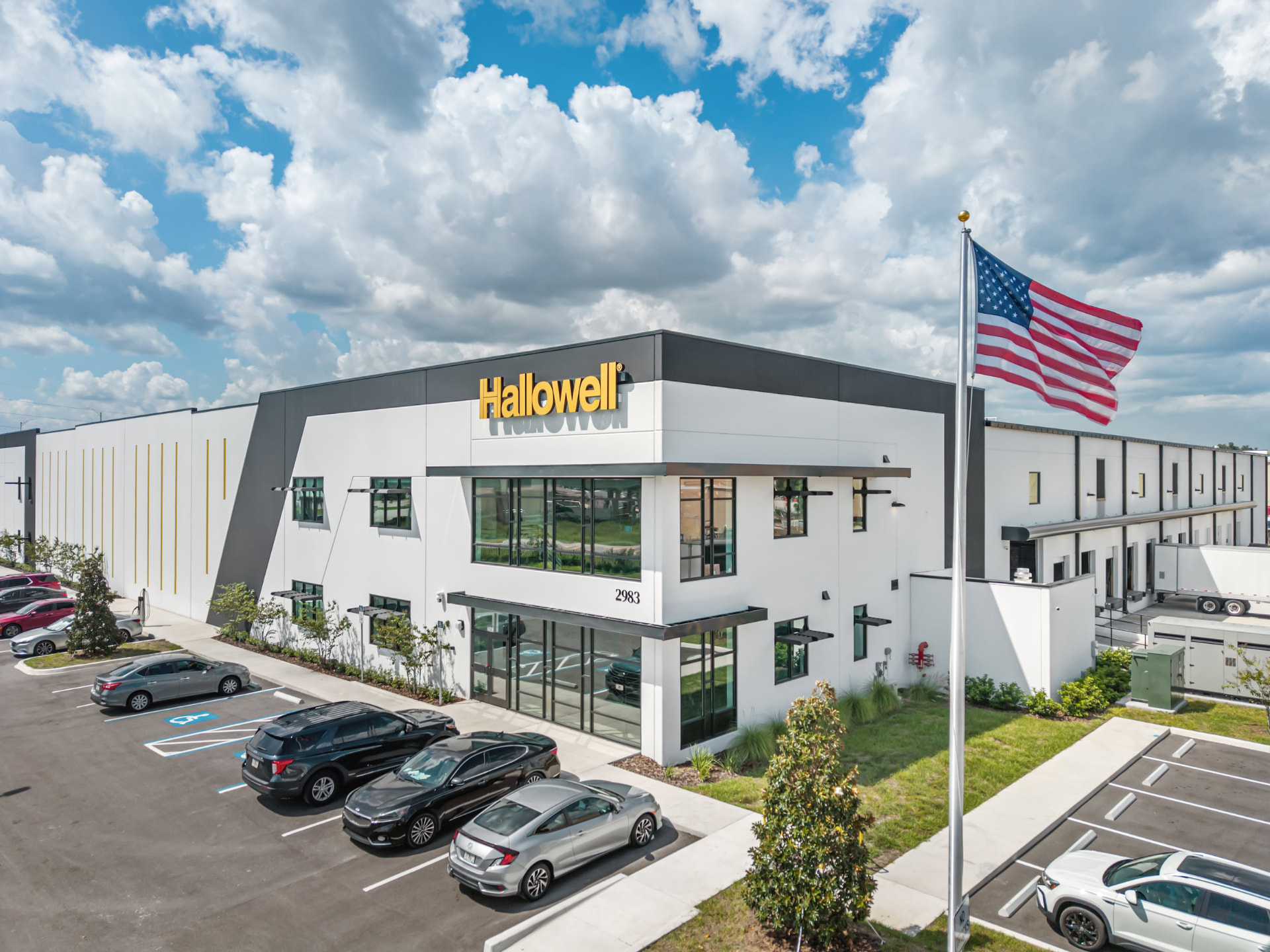 Hallowell facility facade and illuminated signage, daytime aerial photography by IRL Marketing