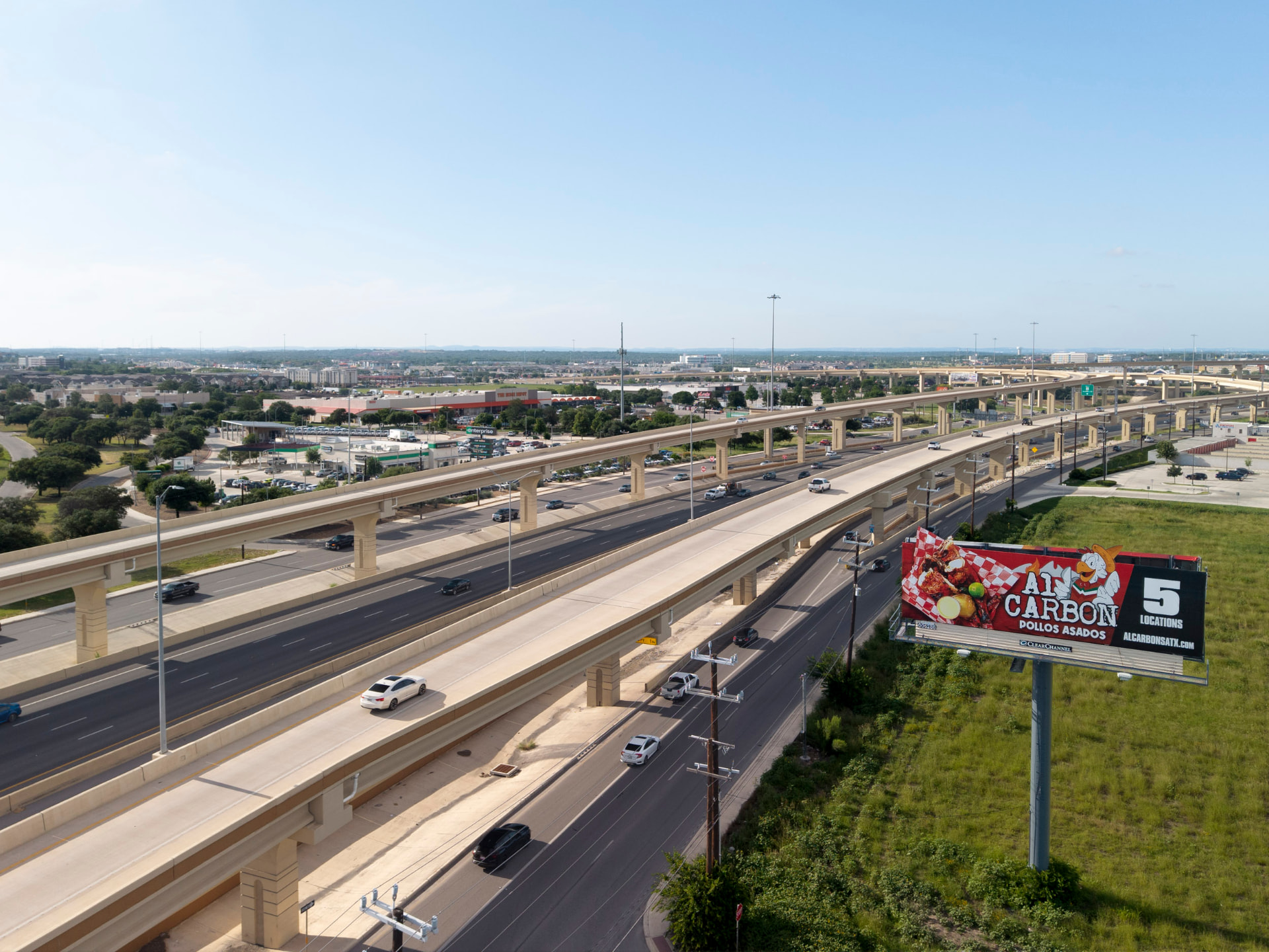 Aerial context photo of a billboard location along a major highway corridor
